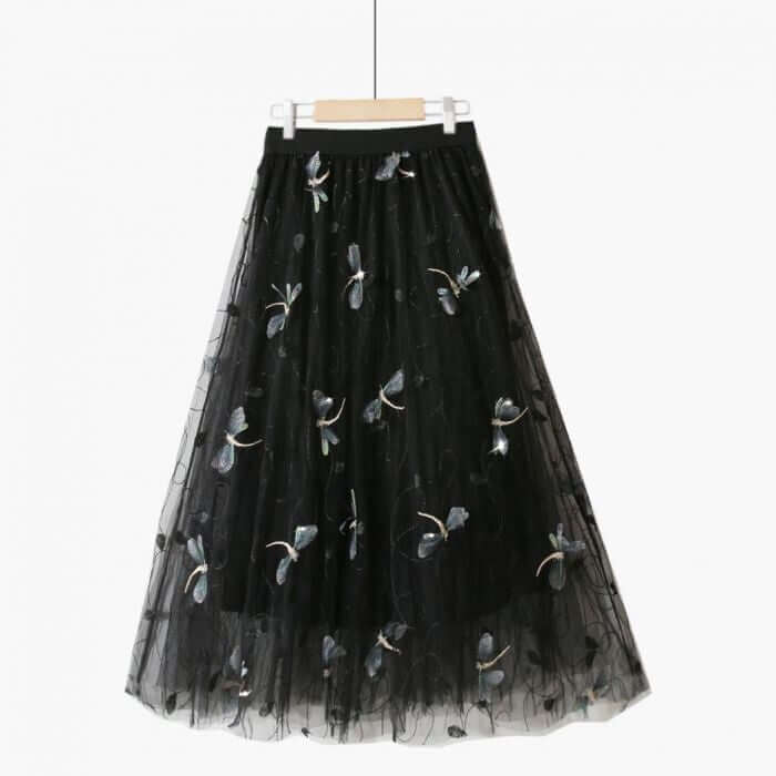 Elegant black tulle midi skirt with floral embroidery, perfect for summer chic fashion.