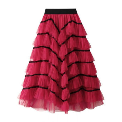 Elegant pink layered tulle maxi skirt with black accents, perfect for summer, stylish and chic women's fashion.