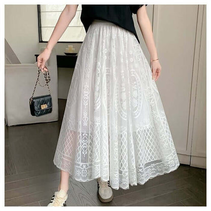 Stylish white lace maxi skirt worn by a woman, showcasing elegant layers and a chic, comfortable design.