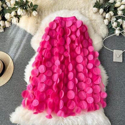 Large circle embellished pink midi skirt with layered tulle design, perfect for stylish and chic women's fashion.