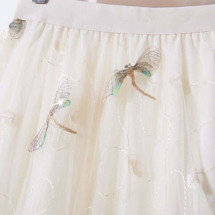 Elegant layered tulle midi skirt with intricate embroidered dragonfly design, perfect for summer wear.