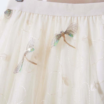 Elegant layered tulle midi skirt with intricate embroidered dragonfly design, perfect for summer wear.