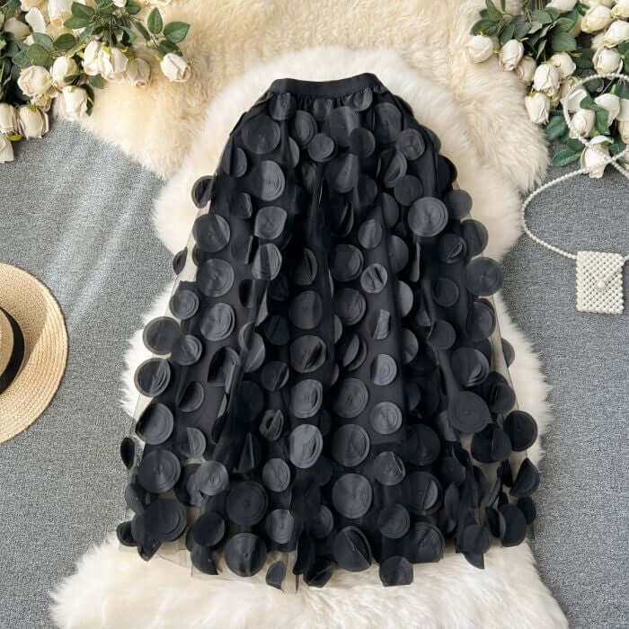 Large black circle embellished midi skirt, stylish and chic, perfect for romantic occasions and versatile wardrobe styling.