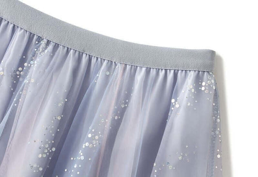 Elegant layered pastel tulle skirt with shimmering sequins and soft elastic waistband for stylish summer fashion.