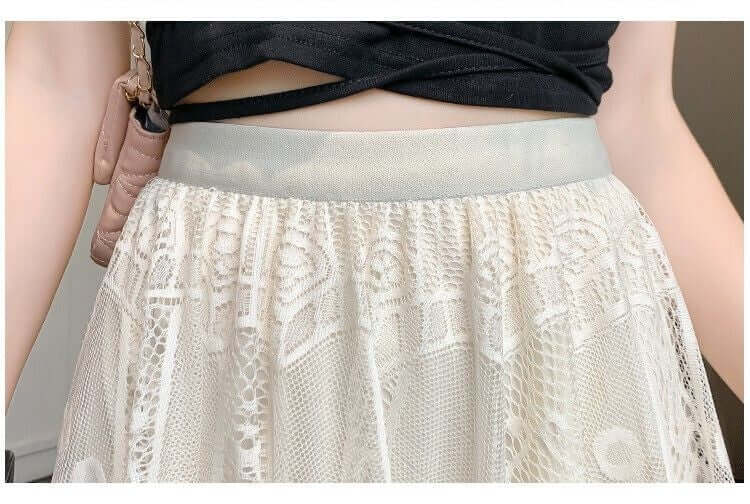 Close-up of a white lace maxi skirt waistband with layered fabric, stylish and chic for women's fashion.
