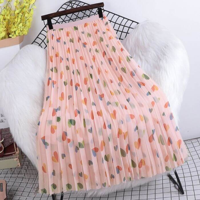 Hearts pattern pleated midi skirt in soft pink tulle, stylish and comfortable fashion for women.