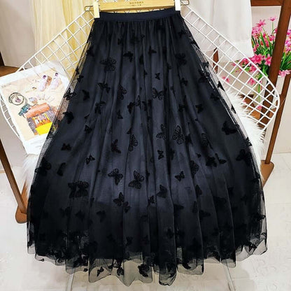Elegant black mesh midi skirt with 3D butterfly design, perfect for stylish and comfortable women's wear.