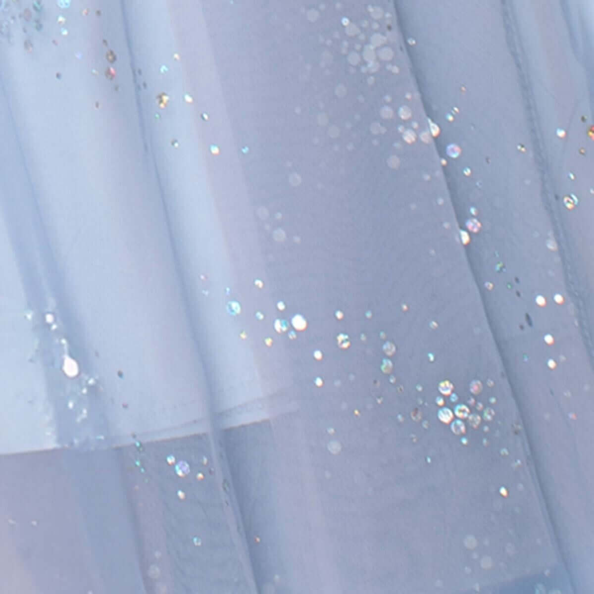 Elegant layered pink tulle fabric with shimmering sequins, perfect for stylish midi skirts in summer collections.