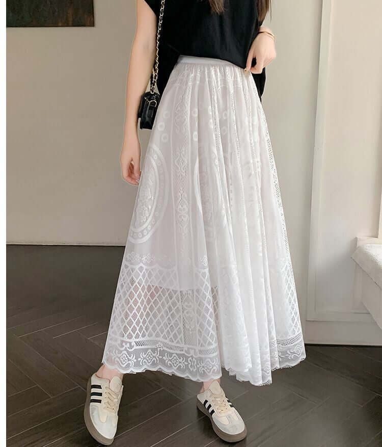 Elegant white lace maxi skirt paired with casual sneakers, showcasing a chic and stylish look for women.