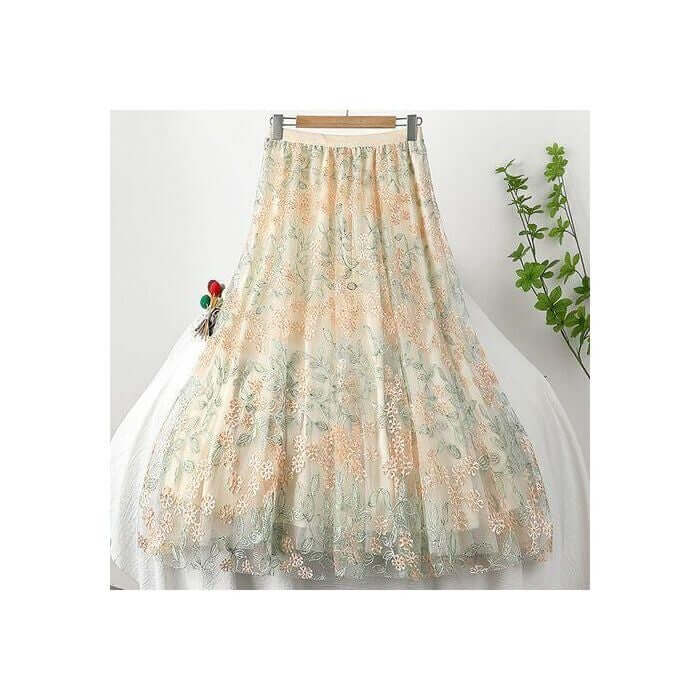 Elegant layered midi skirt with floral design in soft colors, perfect for summer fashion.