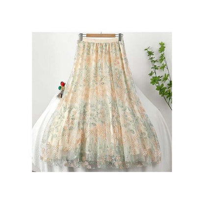 Elegant layered midi skirt with floral design in soft colors, perfect for summer fashion.
