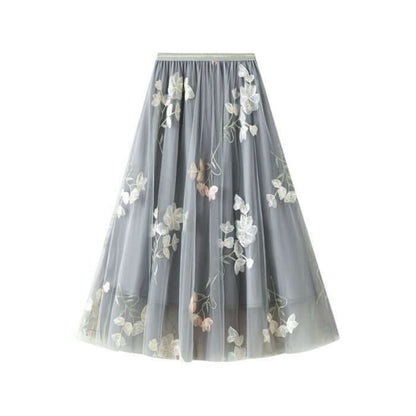 Elegant gray tulle skirt with floral embroidery, perfect for summer fashion and stylish occasions.