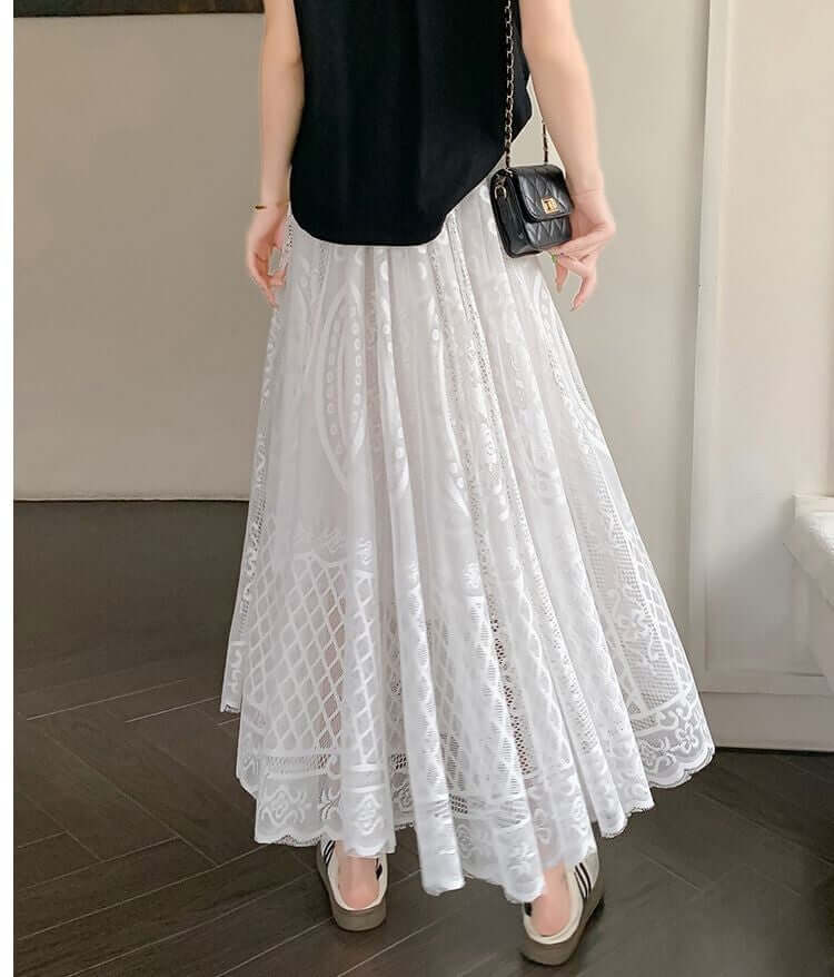 White lace maxi skirt showcasing elegant layered design, offering a stylish and comfortable fit for women.