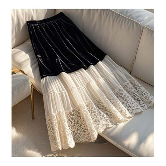 Stylish black and cream velvet lace women's skirt draped elegantly on a couch, showcasing its layered design.