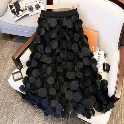 Elegant black circle embellished midi skirt with layered design, perfect for stylish and chic women's fashion.