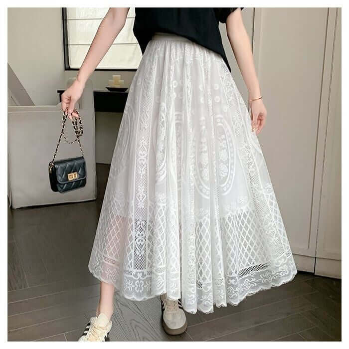 White lace maxi skirt featuring elegant embroidery and a flowing silhouette, perfect for stylish and chic outfits.
